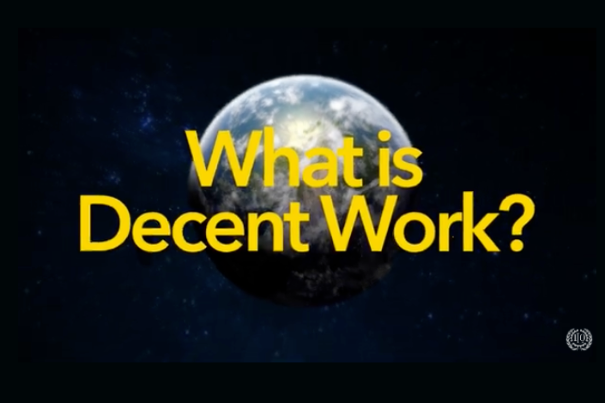 Image of Earth from space with the bold yellow text "What is Decent Work?" overlaid, representing the ILO's focus on fair and productive employment.